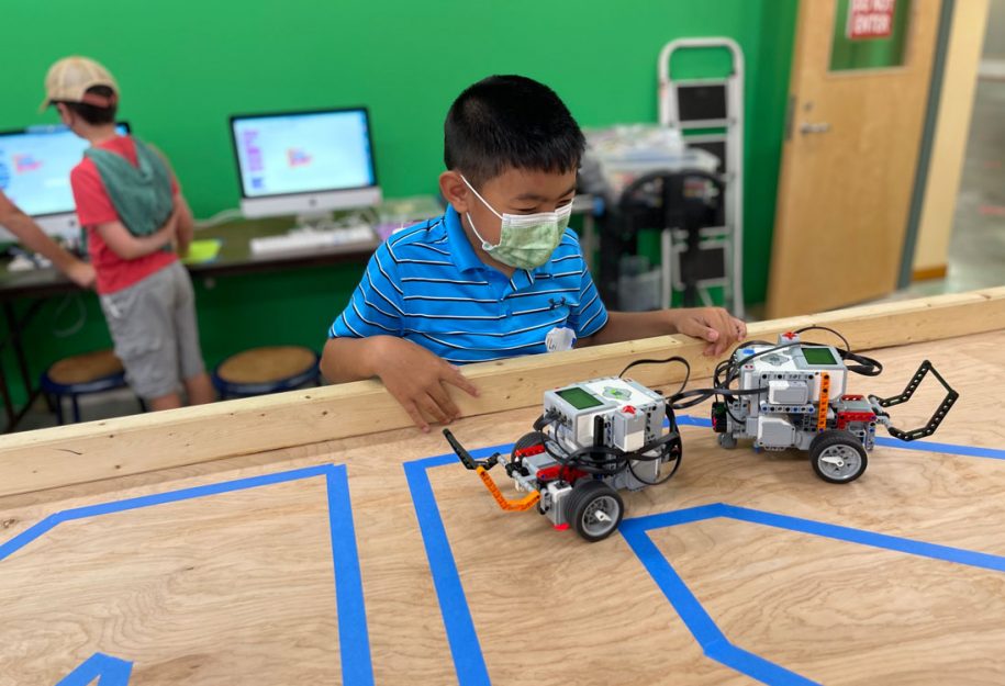 Camper and his robots at FLL camp