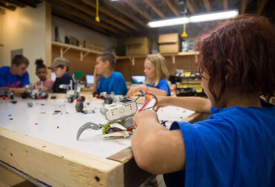 young kids building robots