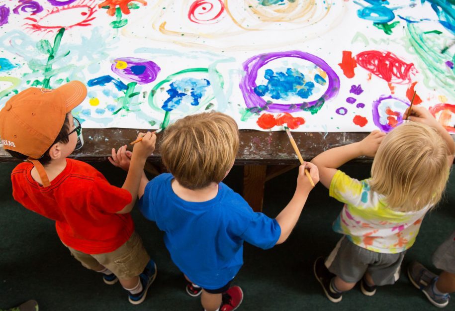 three young kids paint